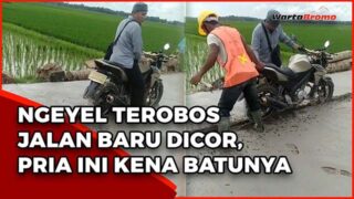 Nekat Terobos Jalanan Baru Dicor, Pemotor Ini Terjebak di Tengah